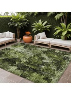 a green area rug with palm trees in the background and couches to the side