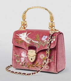 With its structured, vintage-inspired shape, the Mayfair top-handle bag from Aspinal of London is perfect for bringing timeless appeal to your look. Crafted in soft velvet that’s intricately hand-embroidered with motifs based on a springtime English garden, it boasts a front flap which snaps shut with the signature shield lock before opening to reveal a spacious interior with croc-embossed leather trims. Bag Shapes Design, Embroidered Leather Bag, Aspinal Of London Bag, London Mayfair, Embroidered Purse, Embroidered Shoulder Bag, Hand Bags For Women, My Style Bags, Unique Handbags