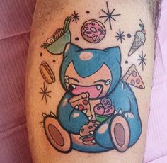 an image of a cartoon cat eating food on the leg with tattoos and piercings