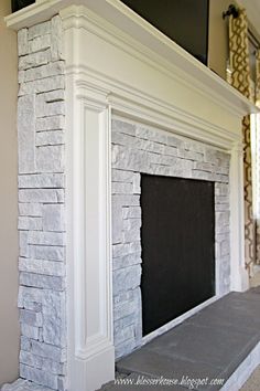 a fireplace with a flat screen tv mounted on it's wall above the mantle