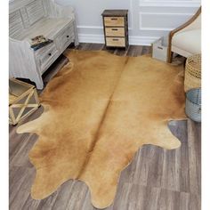 a large brown cowhide rug in a living room