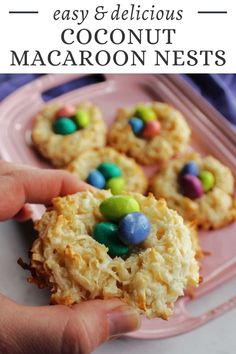 a person holding up some cookies with m & m candies on it and the words easy