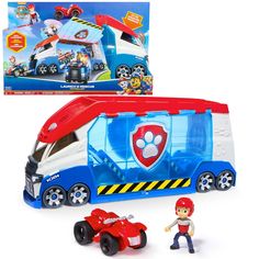 a toy bus with a man next to it in front of a box that says paw patrol