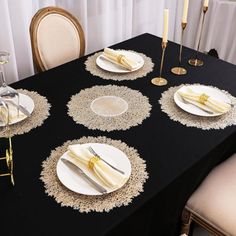 the table is set with place settings for four people to enjoy their meal or dinner