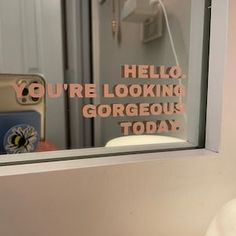 there is a mirror that says hello, you're looking gorgeous today