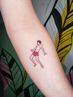 a person with a small tattoo on their arm