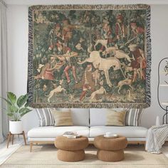 a tapestry hanging on the wall in a living room