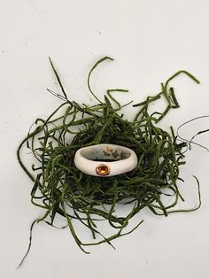 a white object sitting on top of green grass