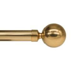 a gold door handle with a ball on the end and a long rod in the middle