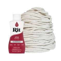 a white rope with a bottle of rit wine bondo next to it on a white background