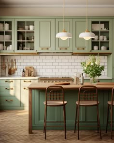 a kitchen with green cabinets and wooden flooring next to two bar stools in front of an island