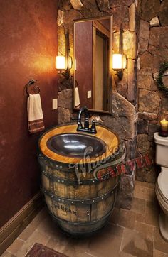 a bathroom with a wooden barrel sink