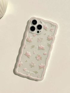 an iphone case with pink flowers on it