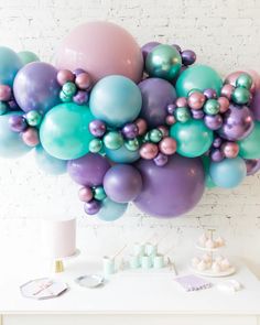 a bunch of balloons that are on a table