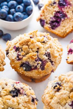 blueberry muffins with fresh blueberries in the background