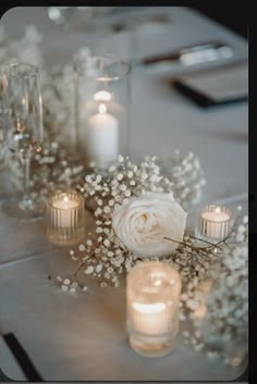 a table with candles and flowers on it