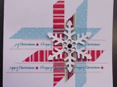 a christmas card with a snowflake on the front and back side, in red white and blue