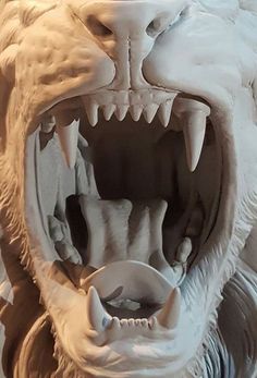 a close up of a sculpture of a bear's mouth with its teeth open