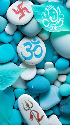 rocks and stones with symbols on them are arranged in the shape of an om sign