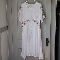 Brand New With Tags Beautiful White With Cream Colored Roses Embroidered Onto Flutter Sleeves And Bodice , Pockets Smoke Free Home Lined, Approx 46" Long Small Spot On Shoulder(See Last Pic) Buttons Are Non-Functioning Tags: Neesee's Dresses, Roolee, Piper And Scoot, Called To Surf , Modest , Church, Wedding, Shower White Rayon Maxi Dress, White Rayon Midi Dress For Daywear, White Short Sleeve Maxi Dress With Floral Embroidery, Floral Embroidered Short Sleeve Maxi Dress For Brunch, White Floral Embroidered Short Sleeve Maxi Dress, White Embroidered Midi Dress With Short Sleeves, White Fitted Rayon Dress, Fitted White Rayon Dress, White Rayon Midi Dress For Vacation