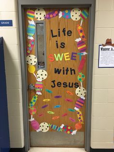 a door decorated with the words life is sweet with jesus written on it and colorful decorations