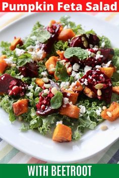 a white plate topped with salad covered in cranberry sauce and feta cheese