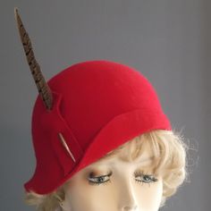 "I have hand blocked this bright red felt on a wooden hat block, using traditional millinery methods. It has a cloche shape, with a partial up turned brim, and a vintage style. A pheasant feather is inserted into a felt holder. Inside is a hand sewn grosgrain ribbon band for hat protection and comfort. Fit 22.5\" to 23\"." Red Vintage Mini Hats With Curved Brim, Fitted Flapper Cloche Hat With Curved Brim, Red Fitted Felt Hat For Formal Occasions, Formal Red Fitted Felt Hat, Elegant Fitted Red Felt Hat, Red Fitted Felt Hat For Kentucky Derby, Fitted Red Felt Hat For Kentucky Derby, Vintage Red Mini Hat For Kentucky Derby, Red Vintage Mini Hats For Kentucky Derby