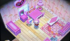 an animal crossing game is playing on the nintendo wii and it's pink furniture