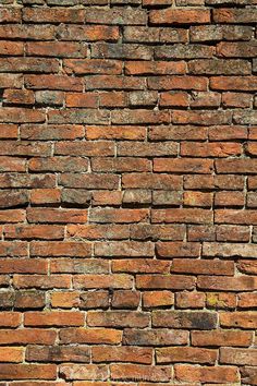 an old brick wall is shown in this image