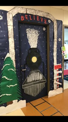 a classroom door decorated for christmas with trees and snowflakes on the front wall