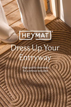 a person standing in front of a door with the words hey mat dress up your entryway