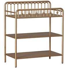 a gold metal shelf with three shelves on each side and a baby crib in the middle