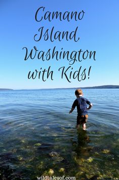 a young boy wading in the water with text that reads, camano island washington with kids