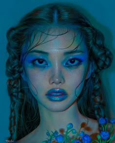 a woman with blue makeup and flowers on her chest is shown in this artistic photo