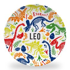 a colorful plate with dinosaurs on it and the word leo written in large letters,