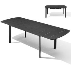 a black table sitting on top of a white floor next to an empty bench with one end missing