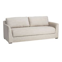 a white couch with two pillows on it