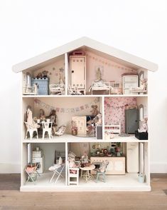 a doll house with furniture and accessories in it