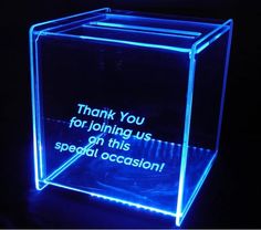 an illuminated glass box with the words thank you for joining us on this special occasion