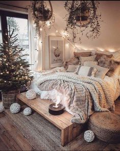 a bedroom decorated for christmas with lights and decorations