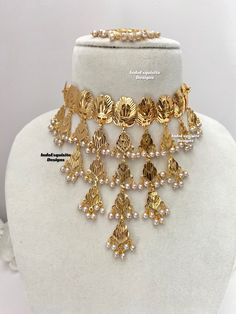 High quality gold plated choker set comes with elegant earrings and Tikka/Indian Punjabi gold plated jewelry/Gold plated Jewelry/Gold look choker set. Bridal /Indian Wedding jewelry/bridal jewelry/ Indian jewelry /Kundan Jewelry/Kundan pearl choker/ Punjabi necklace/ Pakistani jewelry/High quality Indian Jewelry Standard shipping/delivery timeline Below are the estimated delivery times after the order is shipped/dispatched.  ---> USA delivery timeline * 2-6 business days to major urban centers i Punjabi Gold Jewellery Set Traditional, Gold Plated Choker Jewelry Sets, Gold Choker Jewelry Sets For Celebration, Gold Meenakari Sets For Eid, Gold Choker Jewelry Sets For Ceremonial Occasions, Gold Kundan Choker Necklace For Diwali, Festive Gold Bridal Choker Necklace, Gold Choker With Latkans For Celebration, Gold Choker With Latkans For Diwali