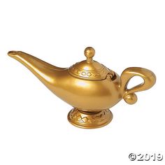 a gold colored teapot on a white background