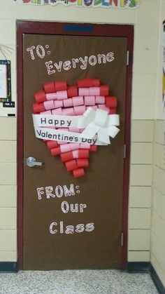 a classroom door decorated with valentine's day paper hearts and words to everyone happy valentine's day from our class