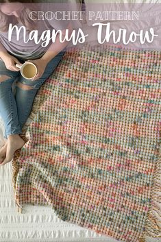 a woman sitting on top of a bed next to a coffee cup and blanket with text overlay reading crochet pattern magnis throw