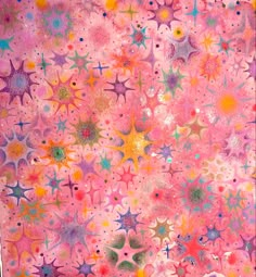 a pink background with many different colored stars and circles on it, as well as the word