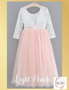 Light Peach Tulle Flower Girl Dress in Long Sleeves Our whimsical Light Peach boho style special occasion dresses are the perfect choice for your little princess. The dress has a gorgeous lace bodice and is long sleeves. While our dresses are widely used as flower girl dresses, they can also be used as birthday dresses, daddy daughter dance dresses, photo shoots, family photos or any other event where you would like your child to feel like a princess. Dress Features A soft white bodice, made of Light Peach Dress, Peach Dress, Flower Girl Dresses Tulle, Junior Bridesmaid Dresses, Light Peach, Junior Bridesmaid, White Maxi, Lace Bodice, Sweet Dress