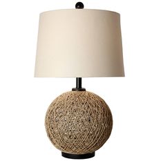 a table lamp with a white shade on it and a black base is shown in front of a white background