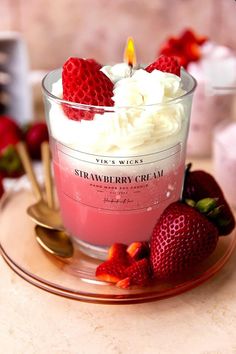 strawberries and whipped cream in a glass dish