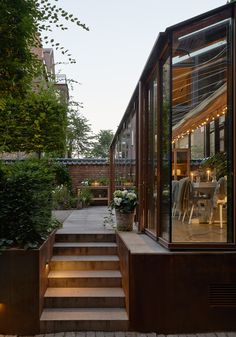 an outdoor patio with steps leading up to the dining room