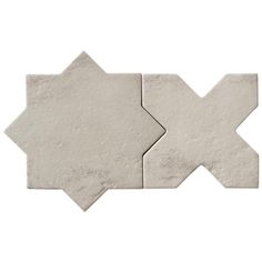 two pieces of white marble with an irregular design on each side and one piece in the middle